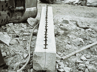 Splitting granite lintels with plugs and feathers