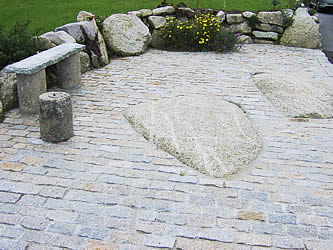 Granite bench on paved area