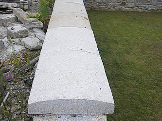 Granite copings capping a free standing wall