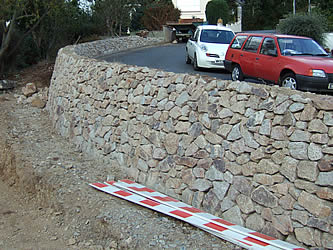 Granite wall by road