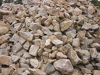 Heap of granite rockery stones for hedging walls
