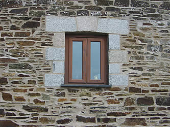 Window with granite quoins and arch