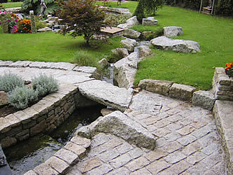 Water feature with granite setts