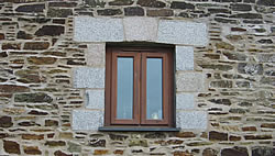 Window with granite quoins and arch